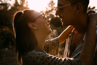 Side view of young woman wearing sunglasses