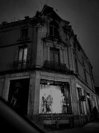 Low angle view of abandoned building against sky