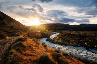 Scenic view of landscape against sky during sunset