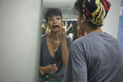 Young woman preparing to go out