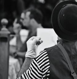 Rear view of mime on street