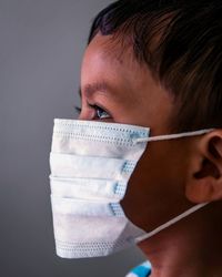 Close-up portrait of boy looking away