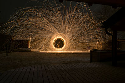 Low angle view of illuminated lights at night