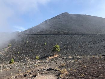 Scenic view of volcanic landscape against sky