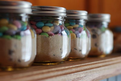 Close-up of candies in jar on shelf
