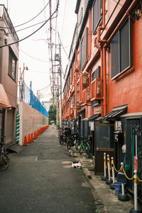 Street amidst buildings in city against sky