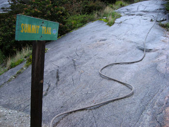 High angle view of arrow sign on road