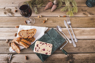 Delicious british cheddar cheese with cranberry on a marble cheese cutting table.