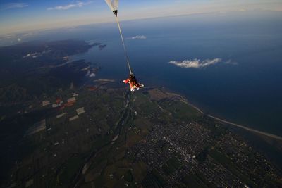 High angle view of man paragliding in mid-air