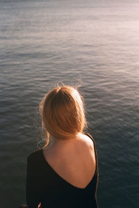 Rear view of woman in swimming pool