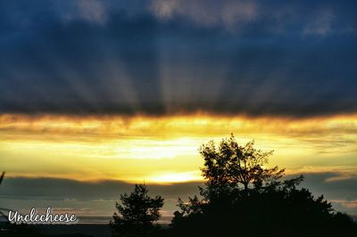 Scenic view of dramatic sky at sunset