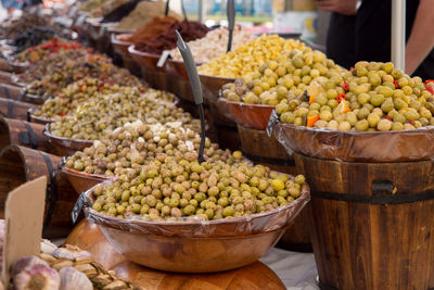 Close-up of various olives for sale at market stall