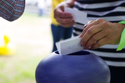 Close-up of man holding umbrella