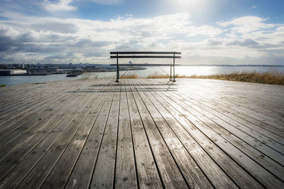 Pier over sea against sky