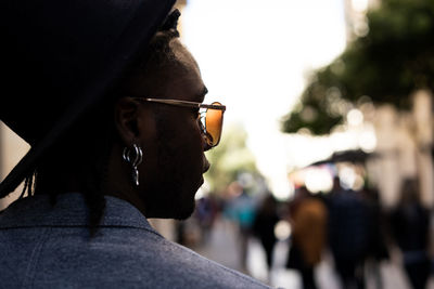 Close-up portrait of young man wearing sunglasses