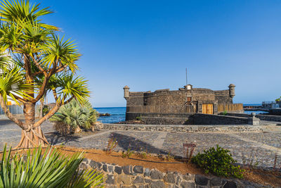 Scenic view of sea against clear blue sky