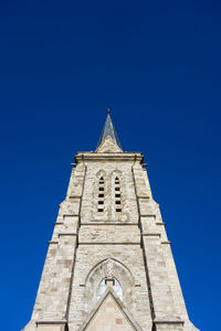 Low angle view of a building against blue sky