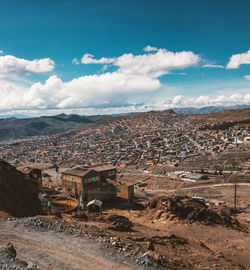 Aerial view of townscape against sky