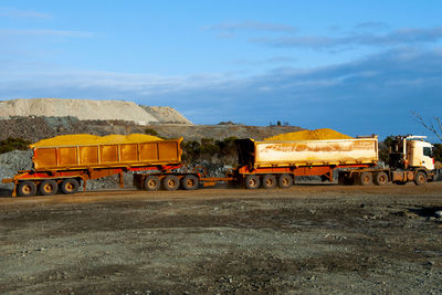 Train on field against sky