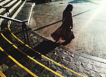 Shadow of woman on wall