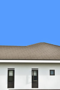 Image of a white house against a blue sky