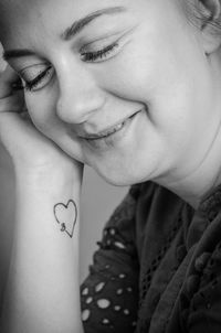 Close-up portrait of a smiling young woman