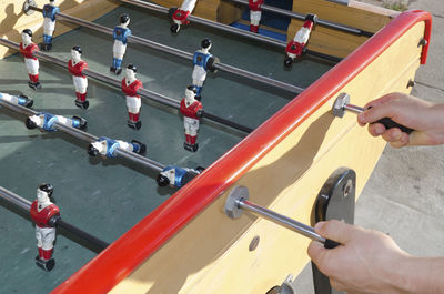 High angle view of person playing foosball