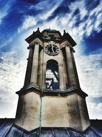 Low angle view of bell tower against sky