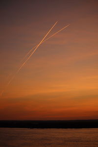 Scenic view of sea against romantic sky at sunset