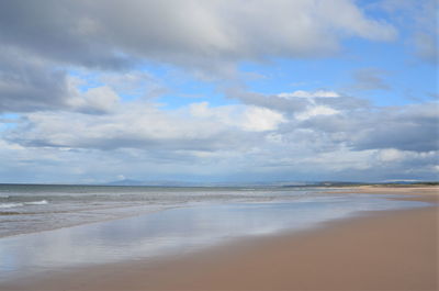 Scenic view of beach against sky