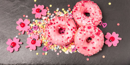 High angle view of donuts with multi colored sprinkles