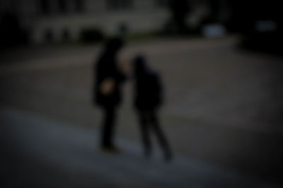 People walking on road at night