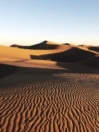 Scenic view of desert against clear sky