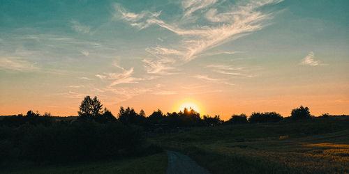 Scenic view of landscape against sky during sunset
