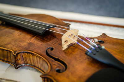 Close-up of violin on musical note