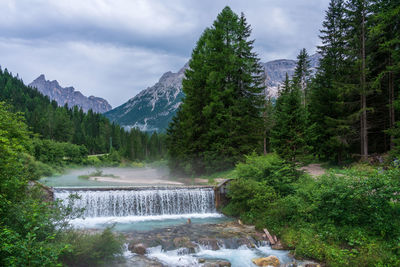 Mountain river in fog, dolomites