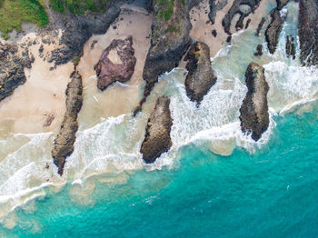 Higj angle view of rock formation in sea