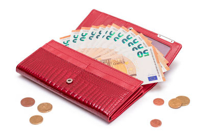 High angle view of paper currency on white background