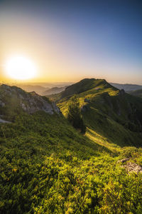 Scenic view of landscape against sky during sunset