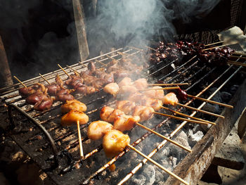 High angle view of meat on barbecue grill