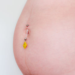 Close-up of woman with hands against white background