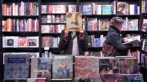 Full length of men standing in shelf