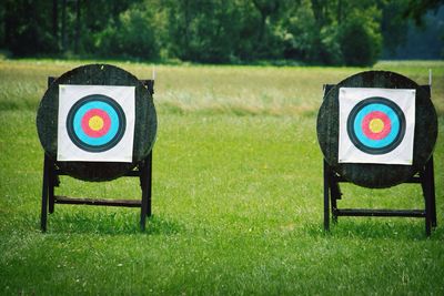 Archery targets on grassy field