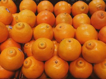 Full frame shot of oranges in market