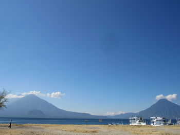 Scenic view of sea against blue sky