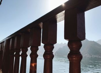 Low angle view of railing against sky