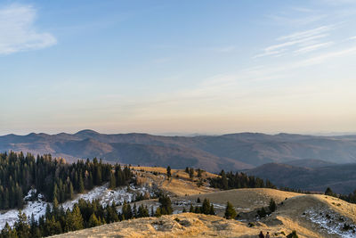 Scenic view of landscape against sky during sunset