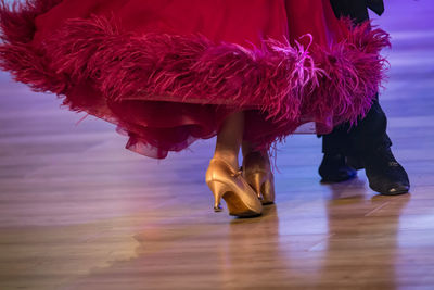 Low section of woman standing on stage