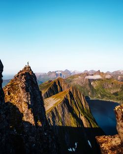 Scenic view of mountains against clear blue sky