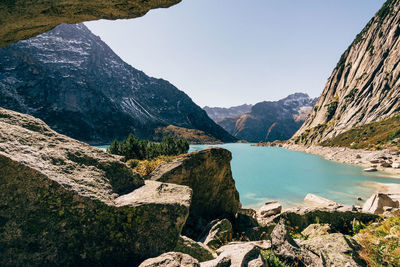 Scenic view of lake and mountains against clear sky